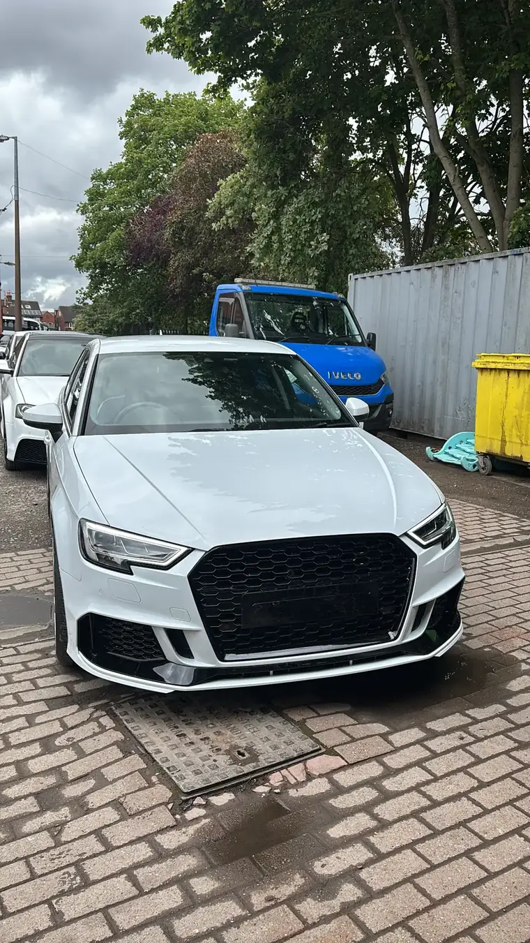White Audi RS3 with grille, headlights and front end work completed