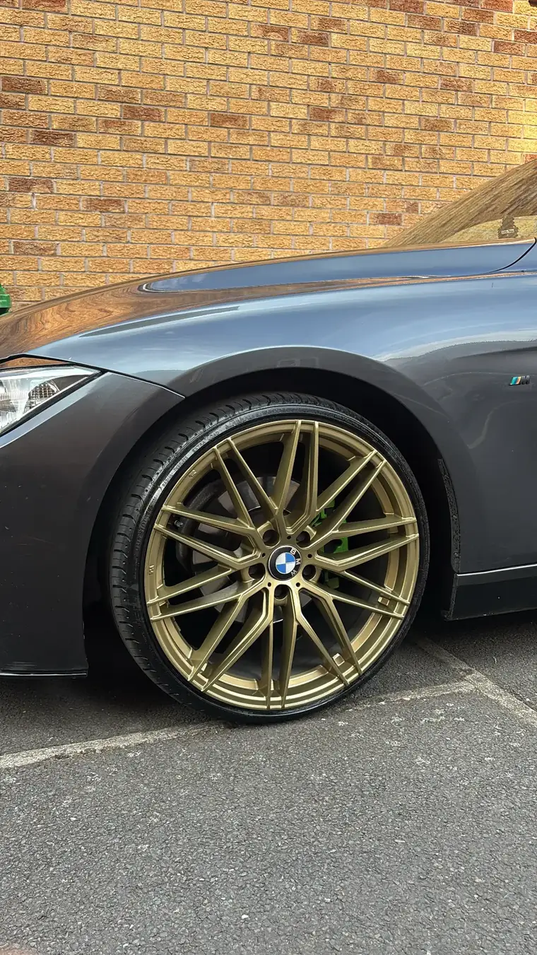 BMW on bronze alloy wheels with green brake callipers